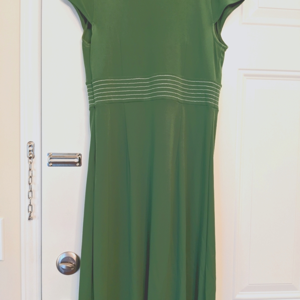 Lovely summer dress. Green with accents of white stitching around the middle.